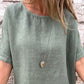 Blusa feminina de algodão e linho, de cor lisa, com gola redonda e mangas curtas